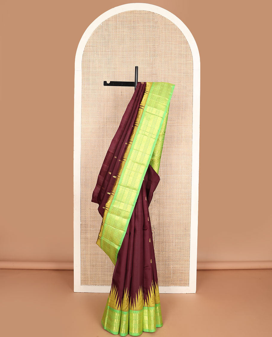 Maroon buttas Kanchipuram silksaree, contrast one-sided temple border of salngai,banaras,cross kamalam & laddu kamalam & floral pallu