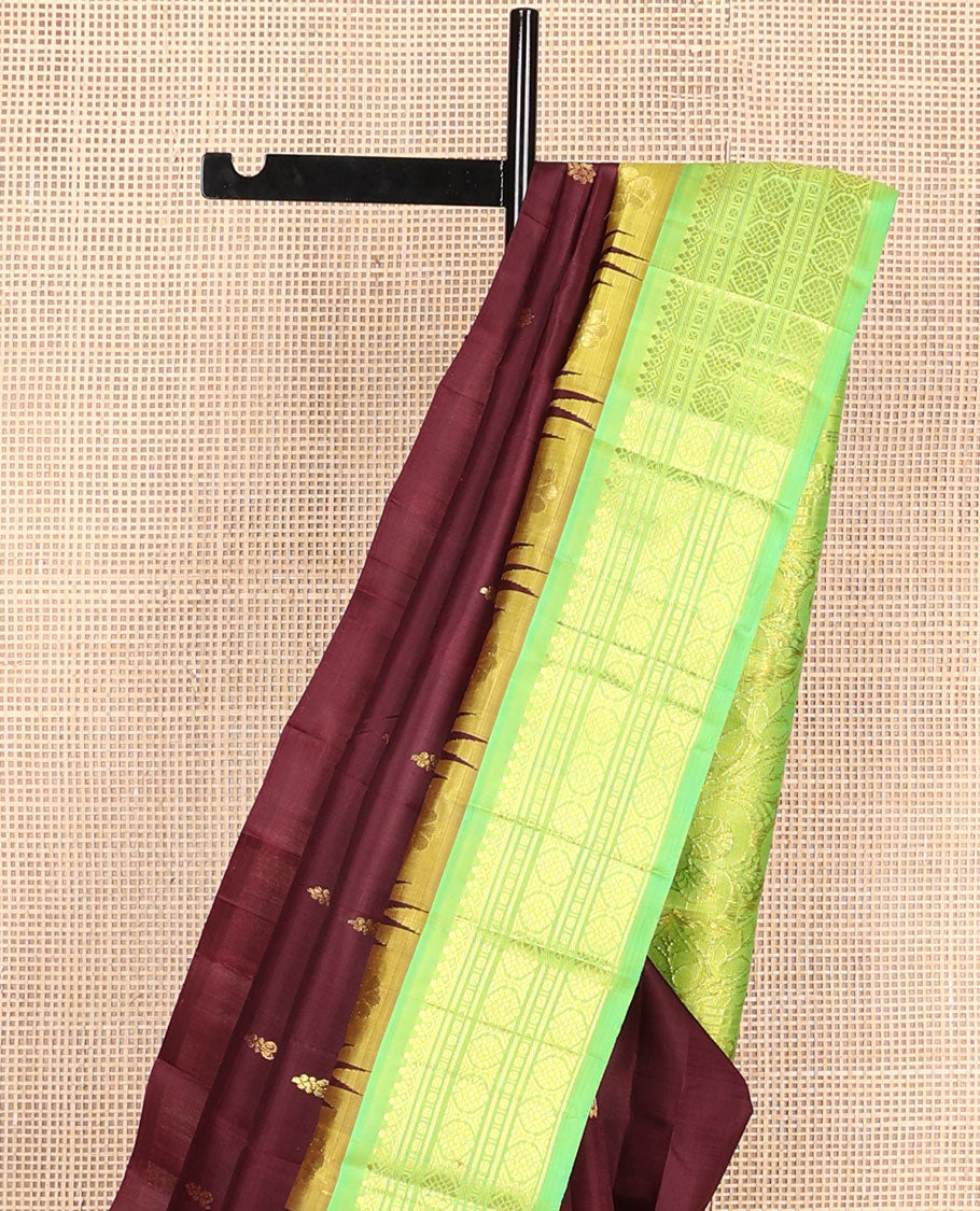 Maroon buttas Kanchipuram silksaree, contrast one-sided temple border of salngai,banaras,cross kamalam & laddu kamalam & floral pallu
