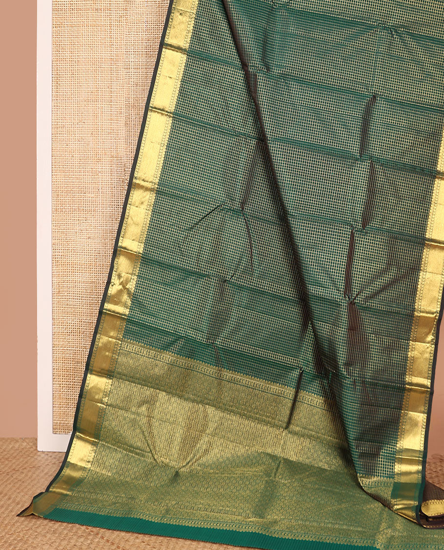 Green zari checked Kanchipuram silk saree, zari border of thilakam mokku, muthu, and manga designs, and jaal pallu
