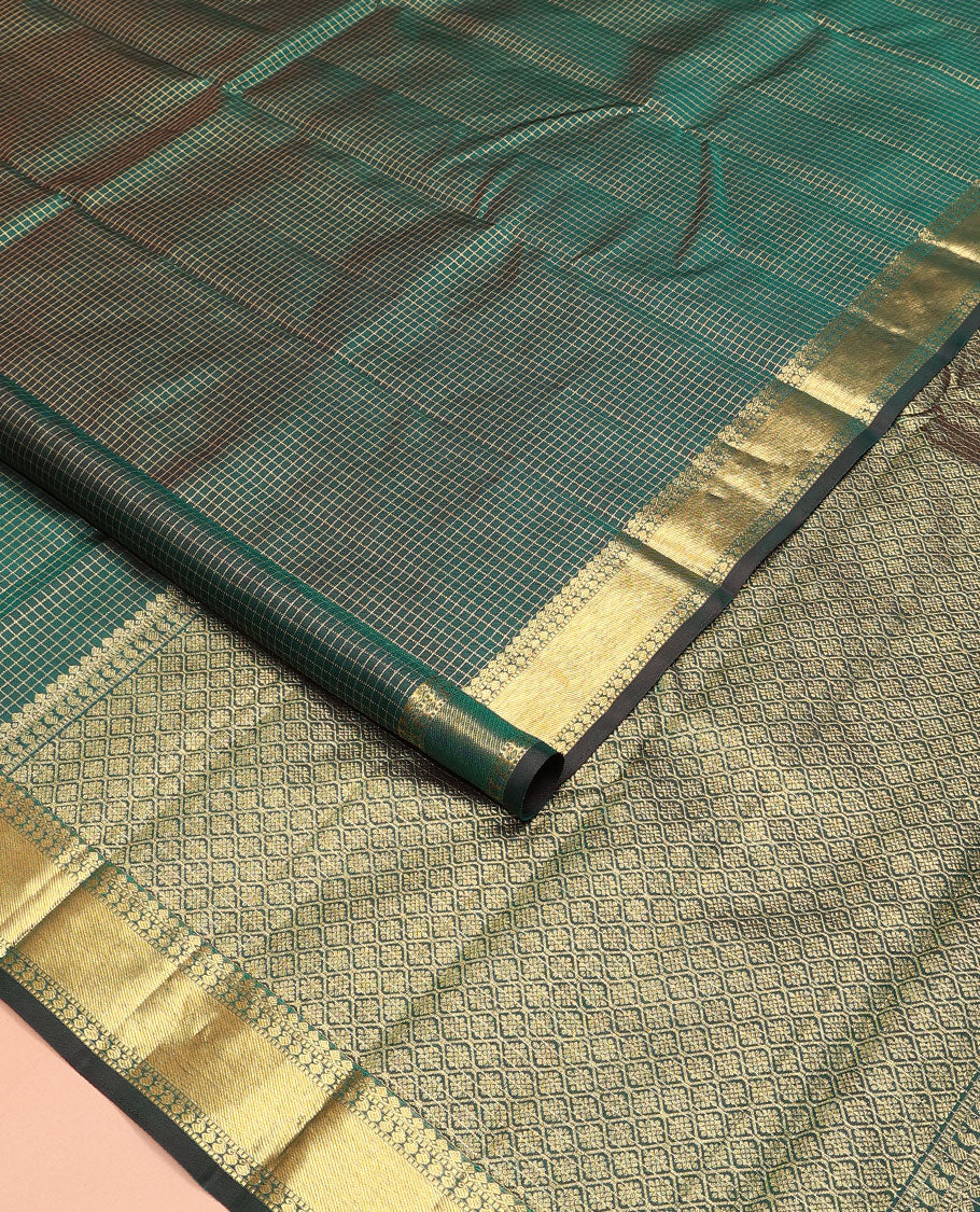Green zari checked Kanchipuram silk saree, zari border of thilakam mokku, muthu, and manga designs, and jaal pallu