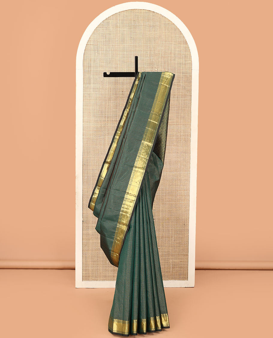 Green zari checked Kanchipuram silk saree, zari border of thilakam mokku, muthu, and manga designs, and jaal pallu