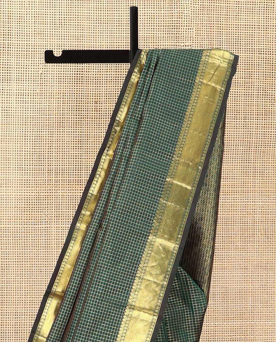 Green zari checked Kanchipuram silk saree, zari border of thilakam mokku, muthu, and manga designs, and jaal pallu