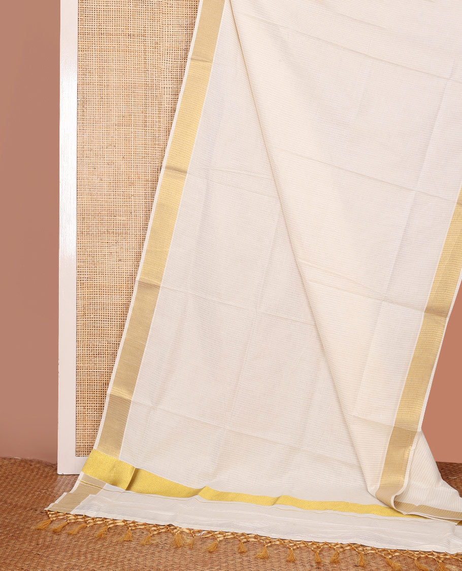 Cream Kerala Saree, Sparsely Woven with Stripes on Its Body, Zari Border, Gleaming Zari Woven Pallu, and Paired with a Matching Blouse