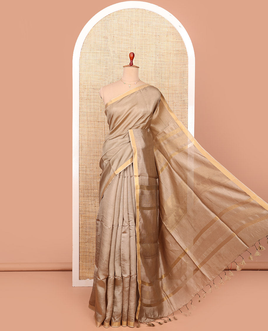 Pale Brown Plain Banana Pith Saree, Subtly Made Zari Bavanji Border, Pallu Featuring Zari Stripes, and Paired with a Matching Blouse