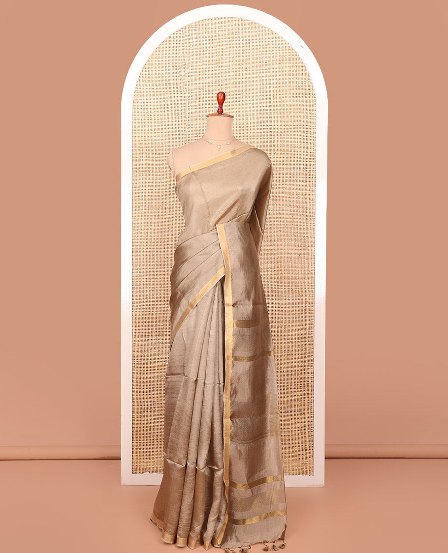 Pale Brown Plain Banana Pith Saree, Subtly Made Zari Bavanji Border, Pallu Featuring Zari Stripes, and Paired with a Matching Blouse