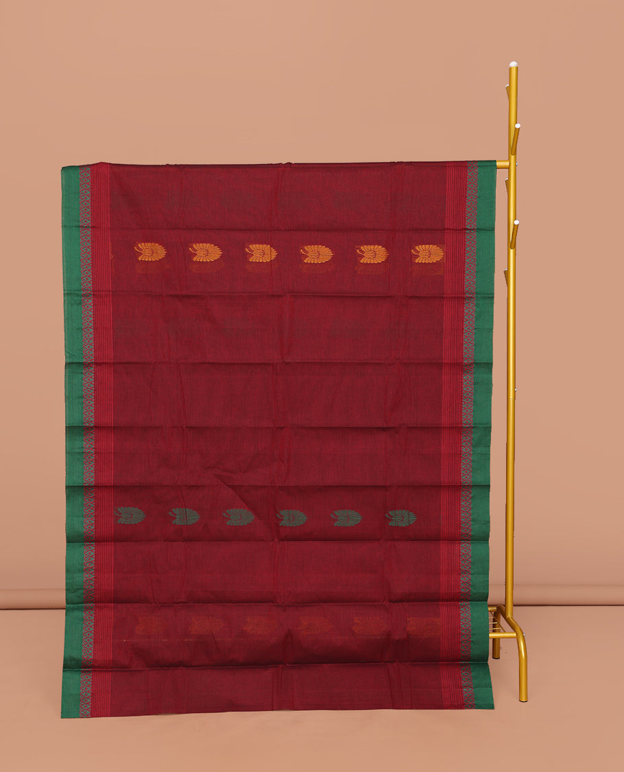 Red Kanchi Cotton Saree, Decorated with Buttas All Over Its Body, Complemented by a Contrast Border, Pallu of Floral and Paisley Designs, and Paired with a Matching Blouse
