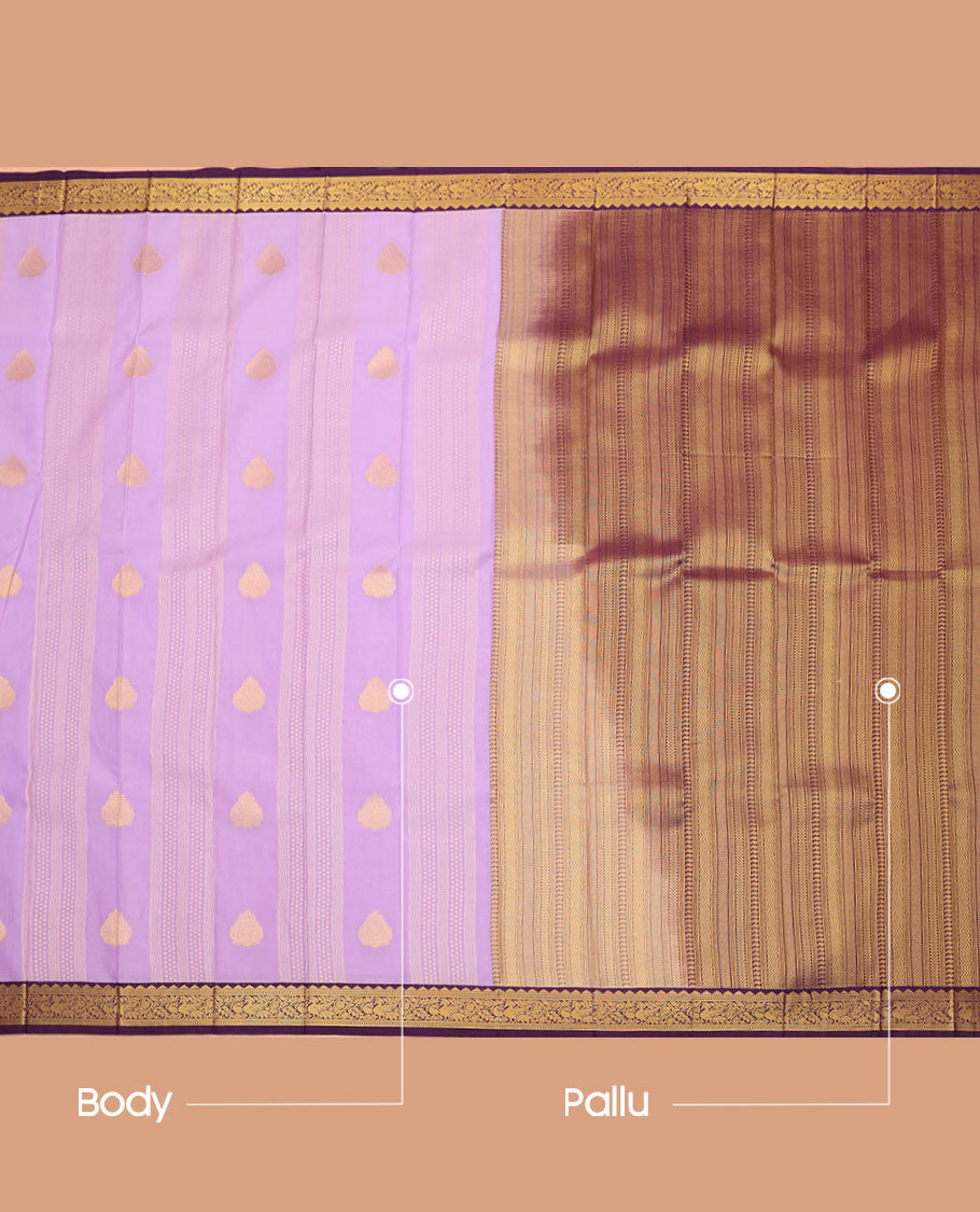 Lavender Budget Silk Saree, Majestically Detailed with Zari Buttas on Its Body, Complemented by a Traditional Zari Border of Peacocks, Geometric Textured Pallu, and Paired with a Contrast Blouse