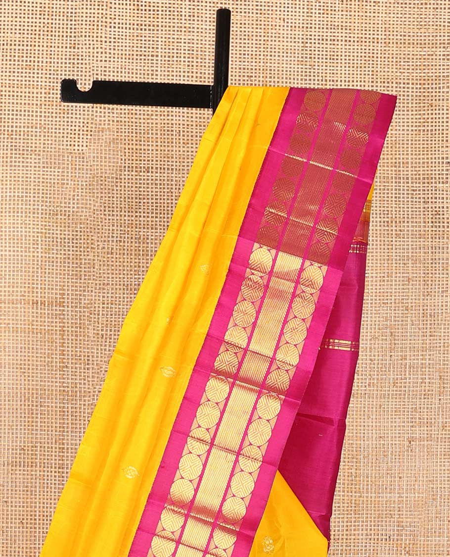 Yellow buttas kancheepuram silk saree with contrast korvai border of paun, banaras design & zari design pallu