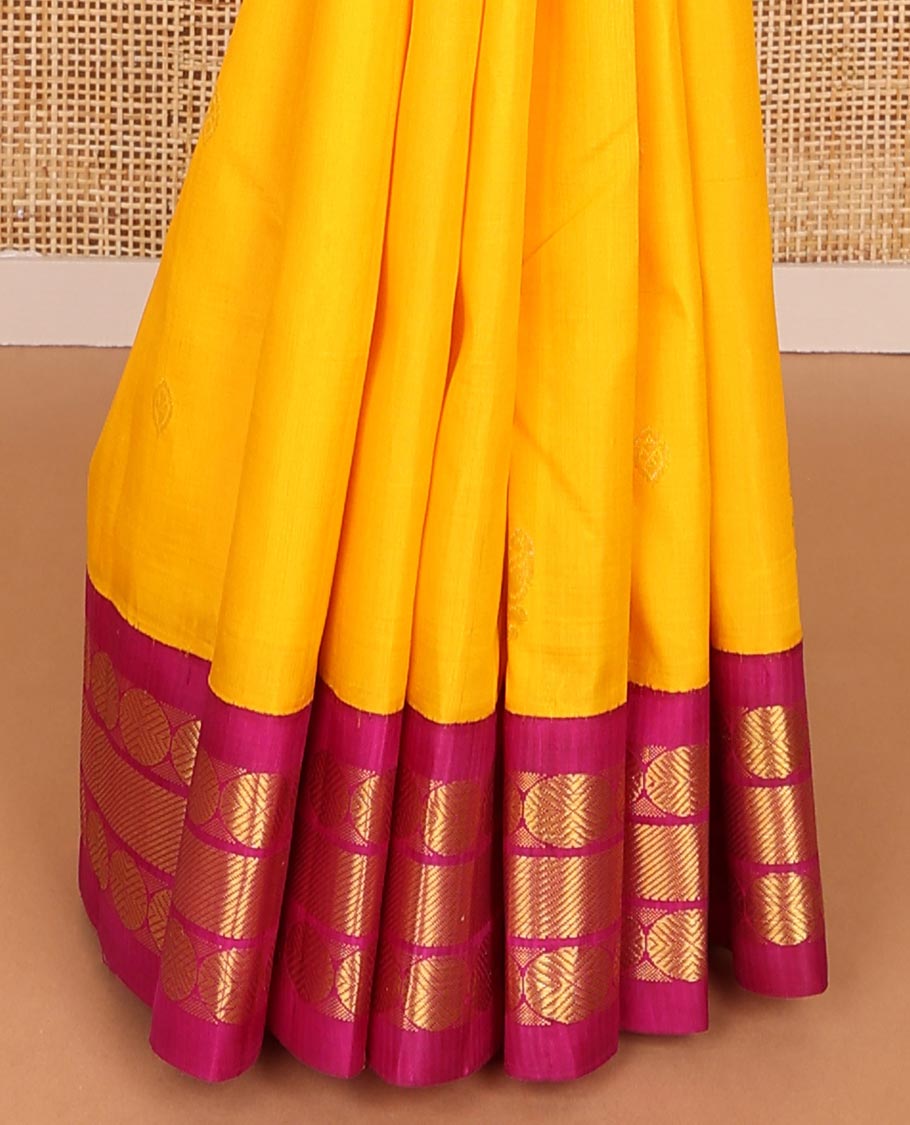 Yellow buttas kancheepuram silk saree with contrast korvai border of paun, banaras design & zari design pallu