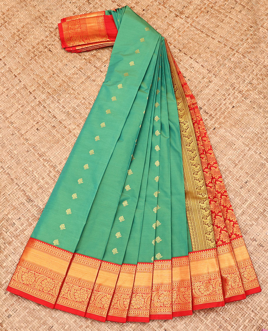 Green Budget Silk Saree, Artfully Detailed with Zari Buttas All Over Its Body, Complemented by a Contrast Traditional Zari Design Border, Pallu of Floral Designs, and Paired with a Contrast Blouse