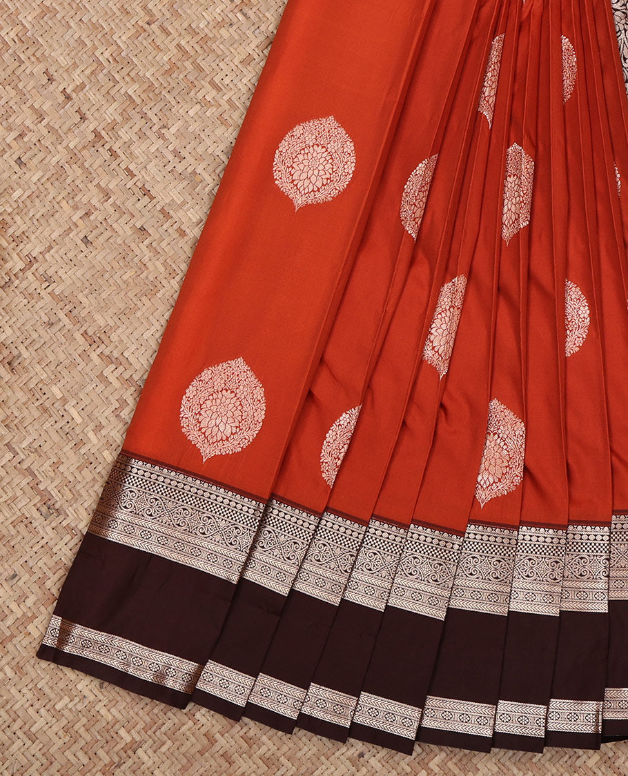 Rust Budget Silk Saree, Embellished with Zari Buttas All Over Its Body, Complemented by a Contrast Traditional Zari Design Rettai Pettu Border, Intricately Designed Pallu, and Paired with a Contrast Blouse