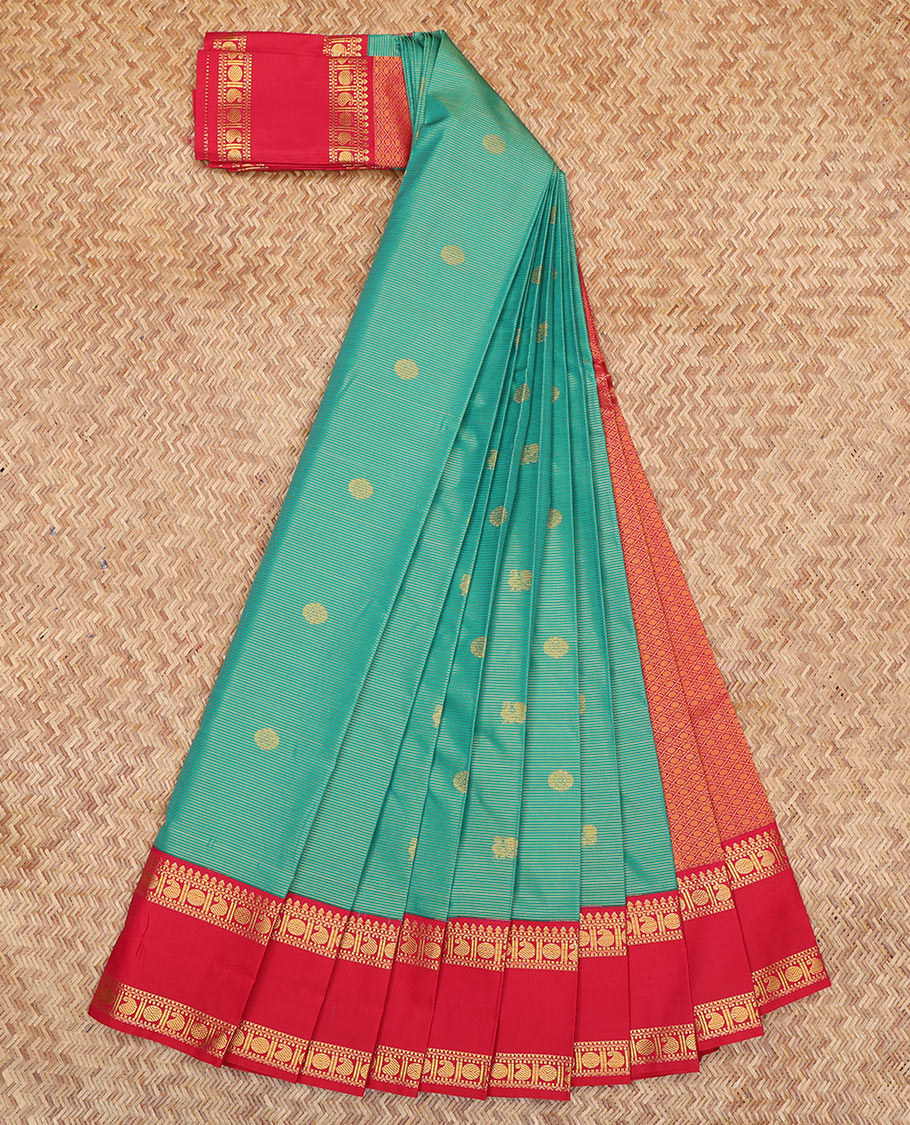 Green Budget Silk Saree, Beautified with Peacock-Chakram Buttas and Stripes, a Contrast Traditional Zari Rettai Pettu Border, Grand Pallu, and a Contrast Blouse