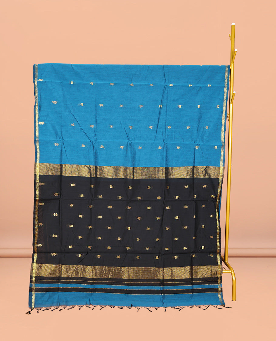 Blue Maheshwari Cotton Saree, Delicately Woven with Buttas All Over Its Body, Subtle Zari Piping Border, Complemented by a Contrast Pallu Steeped with Buttas, and Paired with a Contrast Blouse