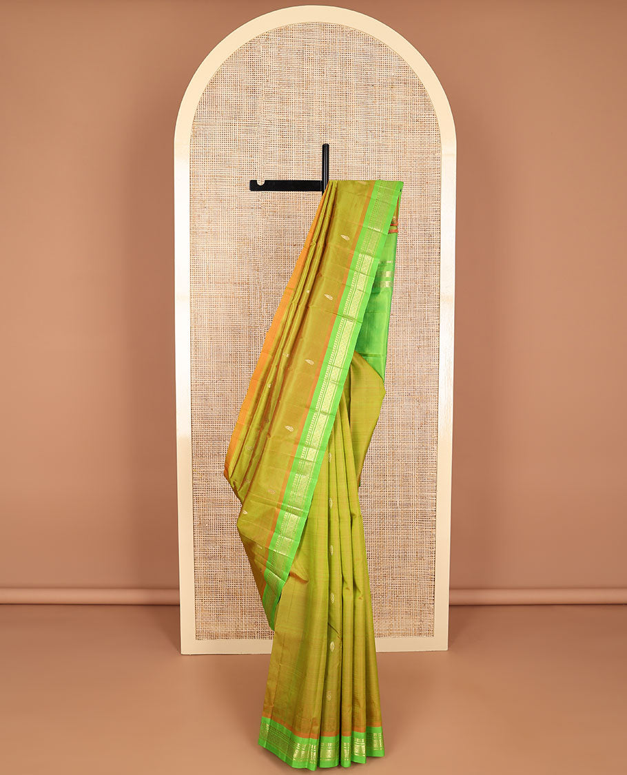 Green buttas kancheepuram silk saree with contrast border of zari design & striped, floral design pallu