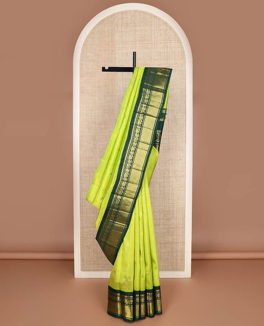 Green zari buttas kanchipuram silk saree, contrast one-sided korvai border of salngai, kodi visiry & jaal & anicient human motifs woven pallu