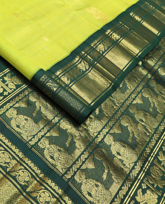 Green zari buttas kanchipuram silk saree, contrast one-sided korvai border of salngai, kodi visiry & jaal & anicient human motifs woven pallu