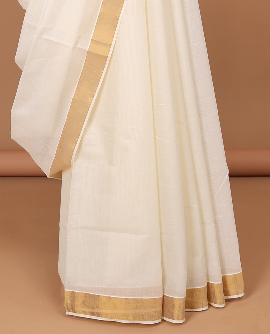 Cream kerala saree with zari stripes, zari border & pallu of intricate designs
