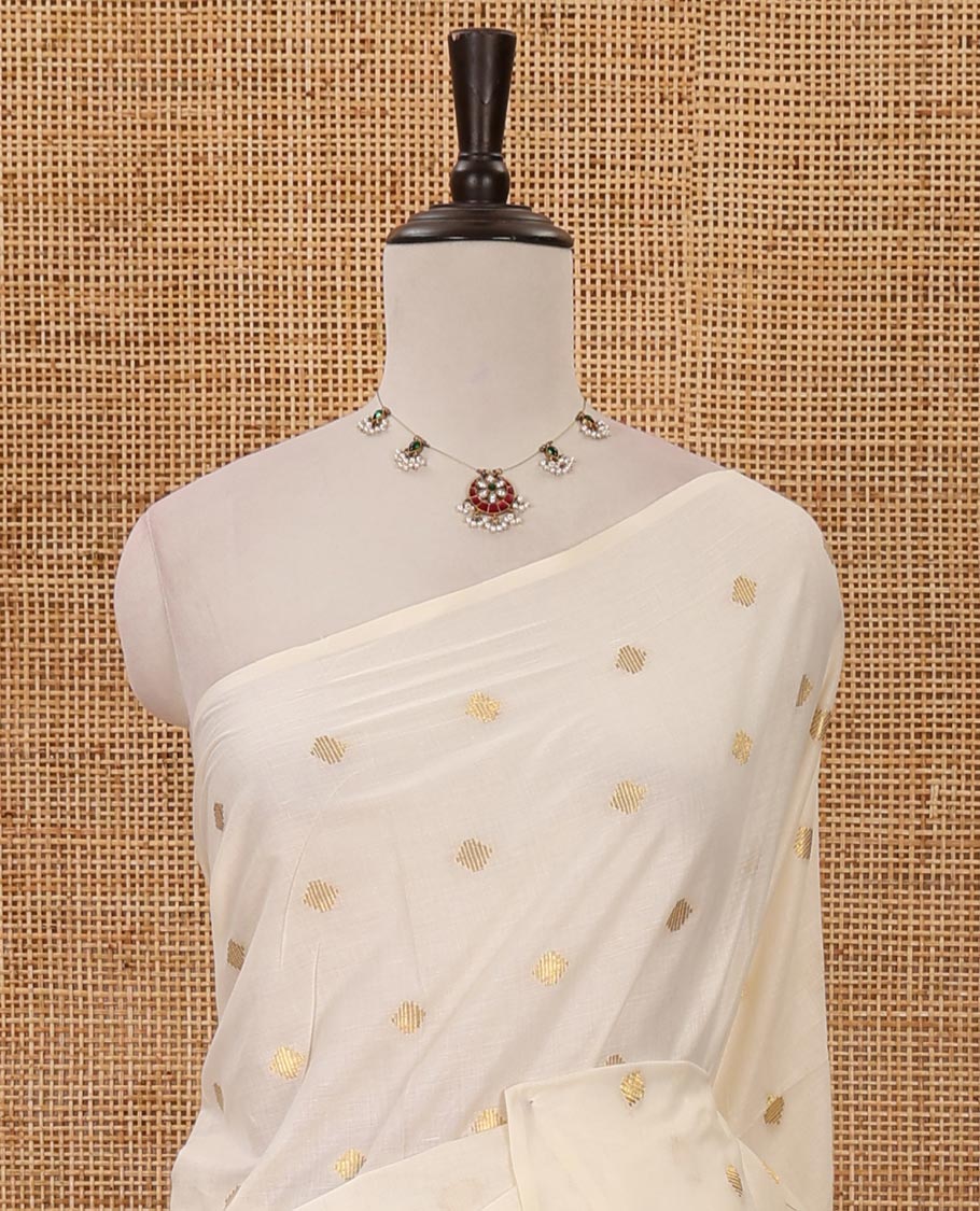 Borderless Kerala cream all over zari buttas saree, zari design pallu with maroon tussels & zari buttas blouse