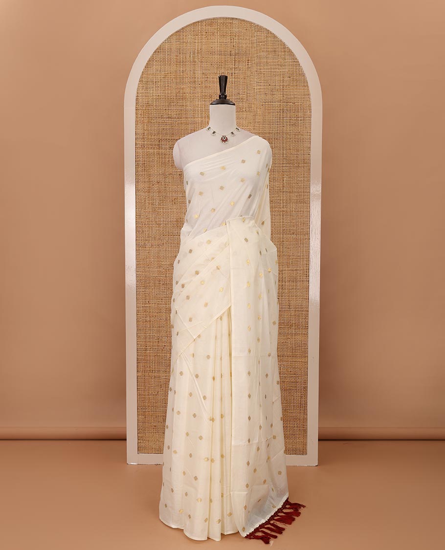Borderless Kerala cream all over zari buttas saree, zari design pallu with maroon tussels & zari buttas blouse