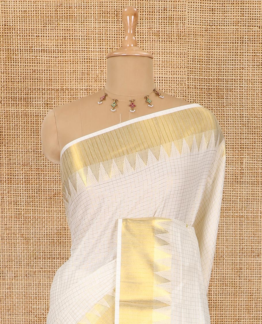 Cream golden zari checked woven Kerala cotton saree, zari temple bavanji border, striped pallu, and a matching blouse