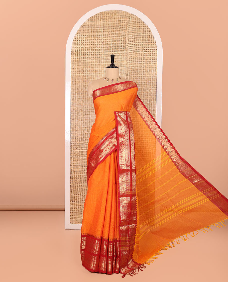 Orange Plain Chettinad Cotton Saree, Complemented by Contrast Traditional Zari Varisai Pettu Border of Peacock and Elephant Designs, Subtly Striped Pallu, and Paired with a Matching Blouse