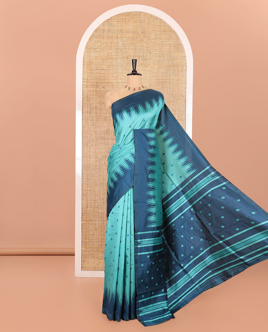 Rama Kanchi Silk Saree, Subtly Woven with Flower Buttas All Over Its Body, Complemented by a Contrast Temple Border, Pallu Mirrors the Same Floral Motifs, and Paired with a Contrast Blouse