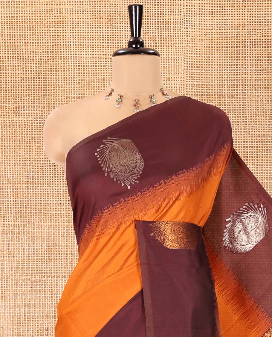 Rust Orange Kanchi Soft Silk Saree, Elevated with Paisley Buttas All Over Its Body, Complemented by a Contrast Paisley Motifs Border, an Intricately Designed Pallu, and Paired with a Contrast Blouse