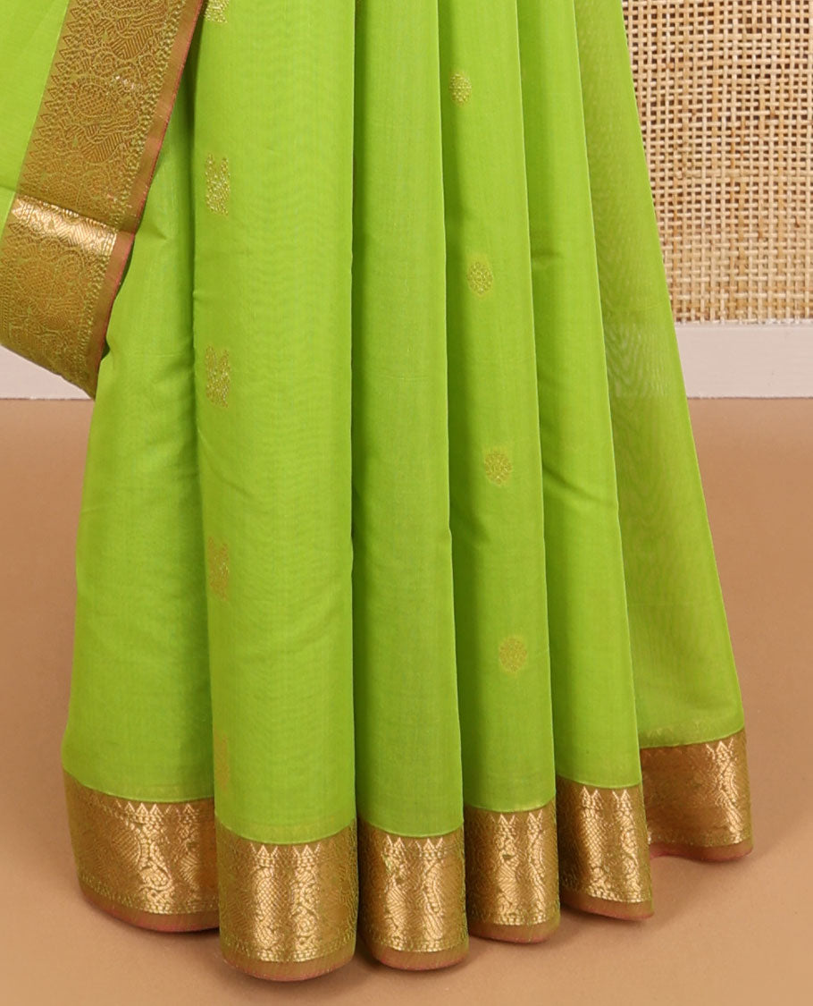 Light green motifs silk cotton saree with intricate zari design border & floral design pallu