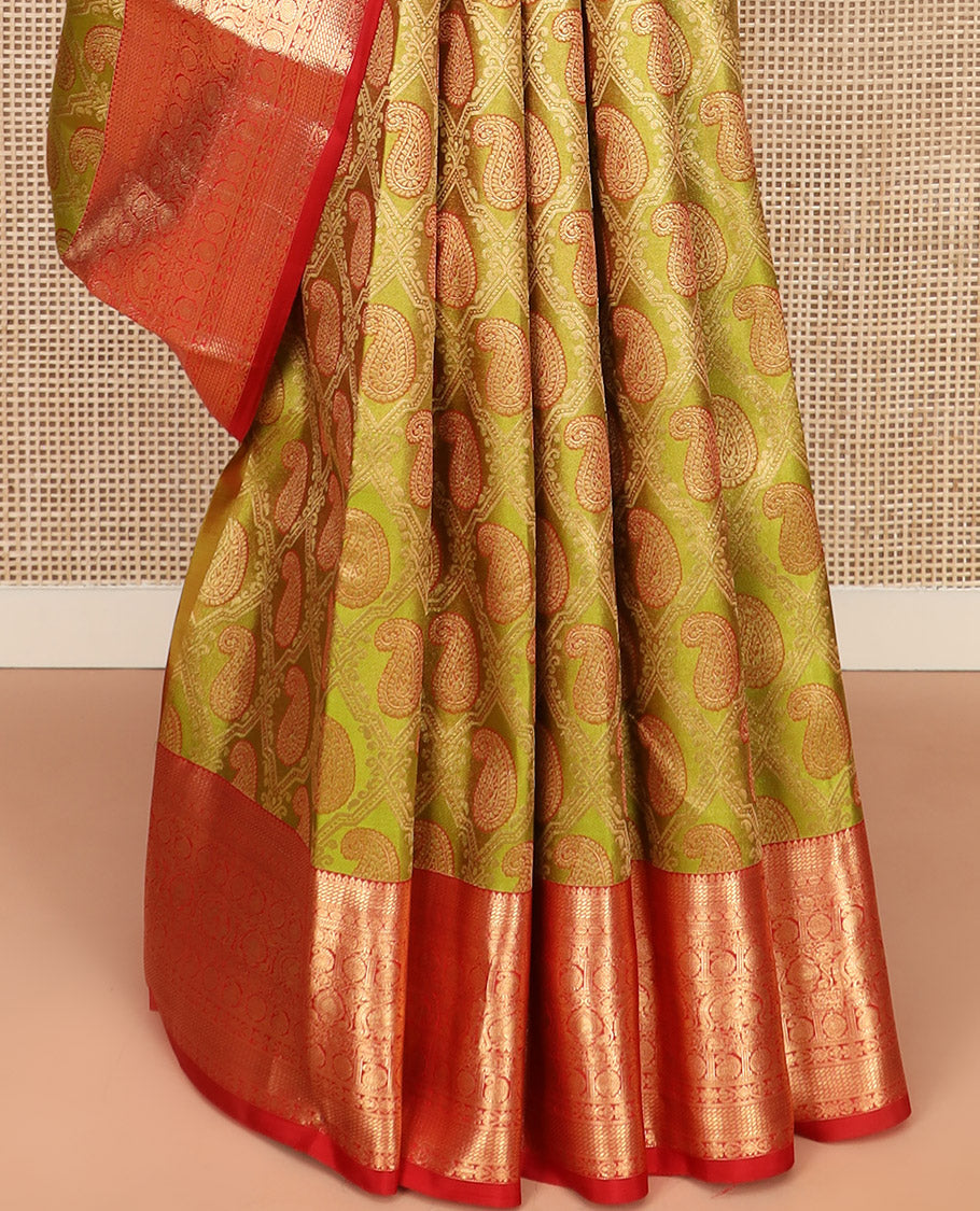 Green Kanchipuram Silk Saree Delicately Woven with Manga Jacquard Design, Complemented by Contrast Border of Thilakam, Chakram, Manga, Kodi Visiry, Mayil, and Jada Nagam Designs, Pallu Gleamed Up with Jaal Designs, and Paired with a Contrast Blouse