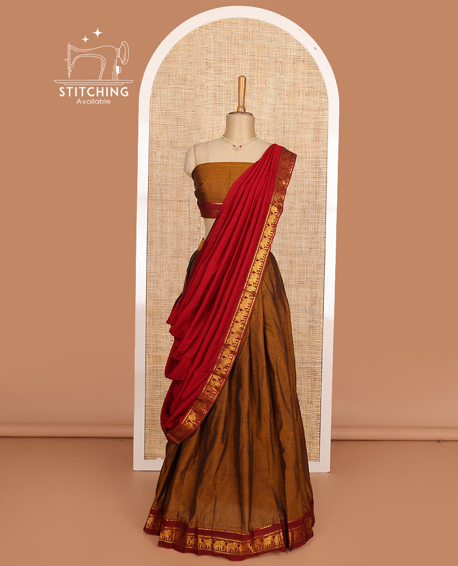 Mustard cotton half-saree, plain with contrast elephant motif bordered skirt, matching blouse, and contrast elephant motif bordered dhavani