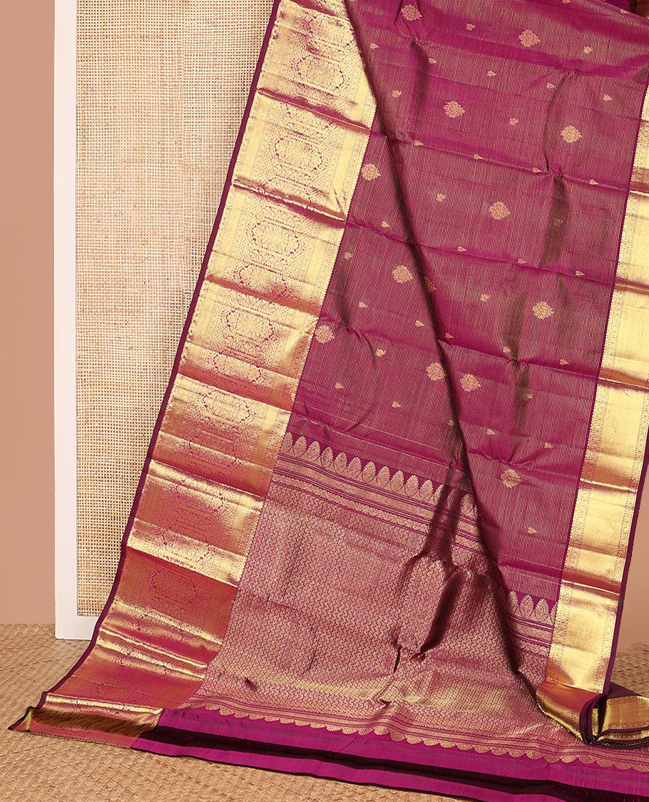 Purple zari stripes and buttas Kanchipuram silk saree, zari border of thilakam, poun, and MUghal-style floral designs, and pallu steeped with manga motifs