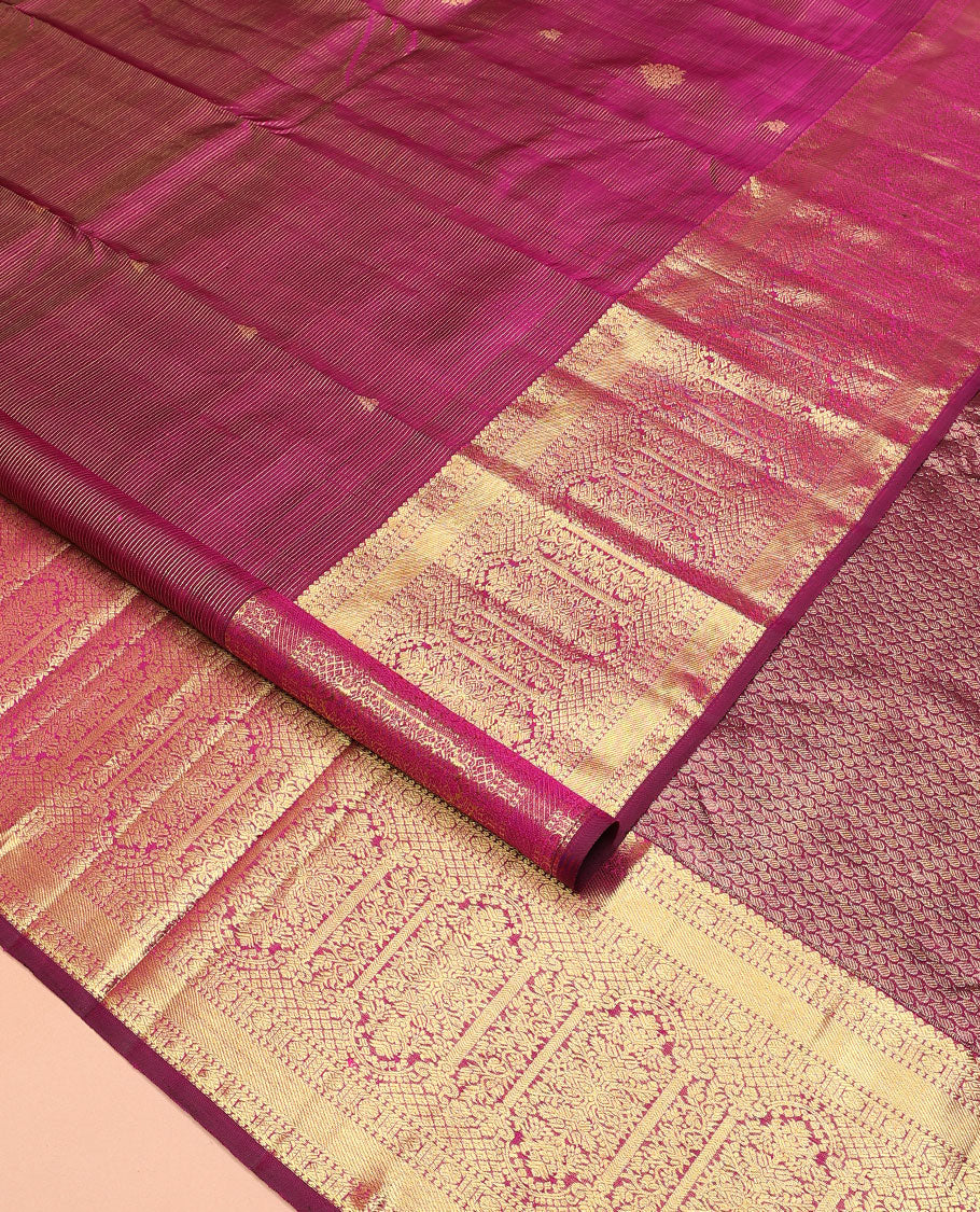 Purple zari stripes and buttas Kanchipuram silk saree, zari border of thilakam, poun, and MUghal-style floral designs, and pallu steeped with manga motifs