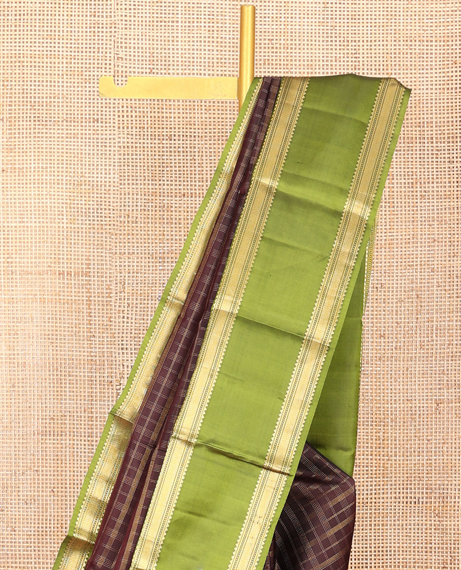 Brown Vasundhara Silk Saree Adorned with Zari Checks, Highlighted by a Contrast Rettai Pettu Border of Rekku, Muthu, Banaras, and Mayil Kann Designs, a Zari-Woven Pallu of Kathir Designs, and Paired with a Contrast Blouse
