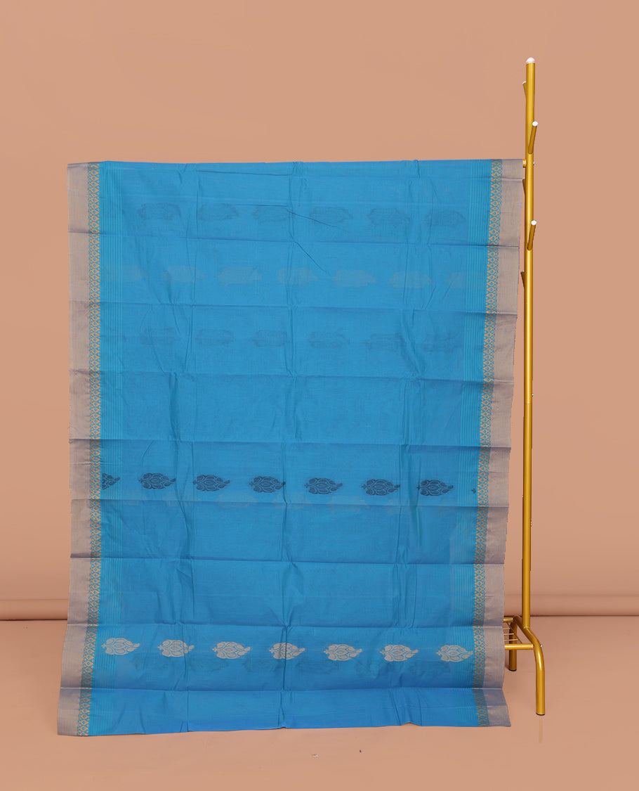 Blue Kanchi Cotton Saree, Accentuated with Buttas All Over Its Body, Complemented by a Contrast Border, Pallu of Floral and Paisley Designs, and Paired with a Matching Blouse