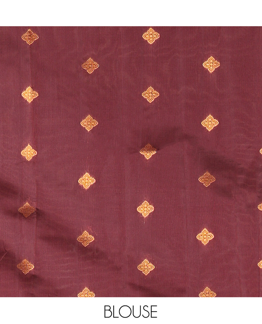 Rust Orange Kanchi Soft Silk Saree, Elevated with Paisley Buttas All Over Its Body, Complemented by a Contrast Paisley Motifs Border, an Intricately Designed Pallu, and Paired with a Contrast Blouse