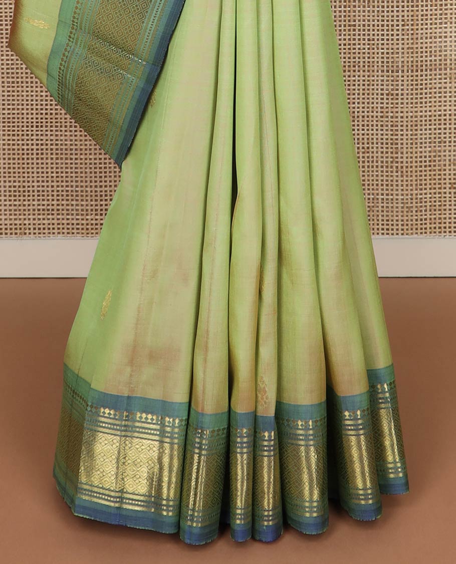 Green zari buttas kanchipuram silk saree, contrast one-sided korvai border of panner sombu,banaras,muthu & jaal & zari design pallu