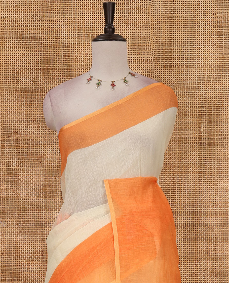 Cream full-plain linen saree, contrast orange big plain border, plain pallu & buttas printed matching blouse