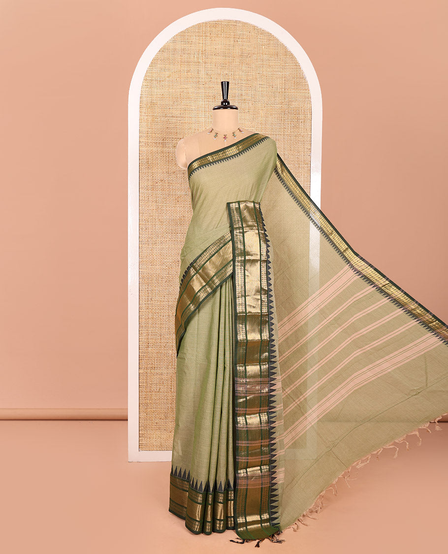 Green Plain Chettinad Cotton Saree, Complemented by Contrast Temple Border of Traditional Zari Designs, Subtly Striped Pallu, and Paired with a Matching Blouse