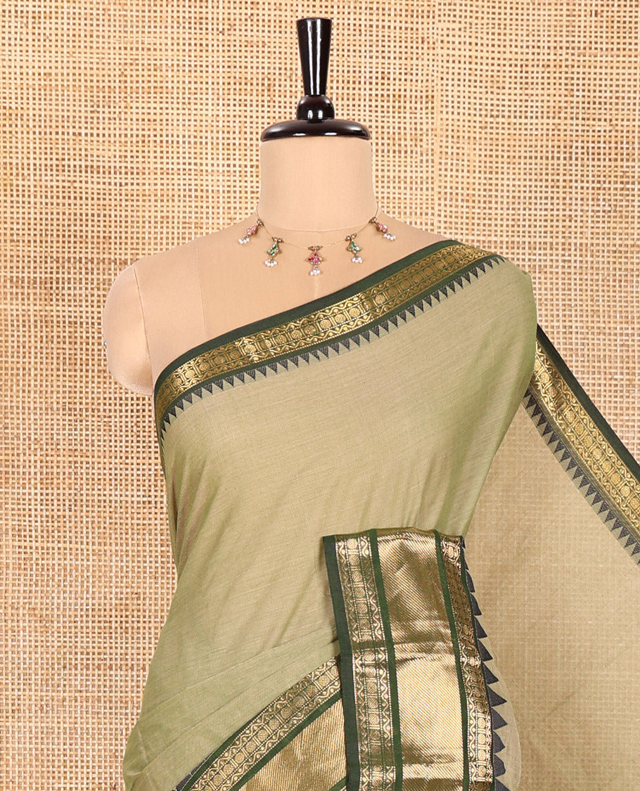 Green Plain Chettinad Cotton Saree, Complemented by Contrast Temple Border of Traditional Zari Designs, Subtly Striped Pallu, and Paired with a Matching Blouse