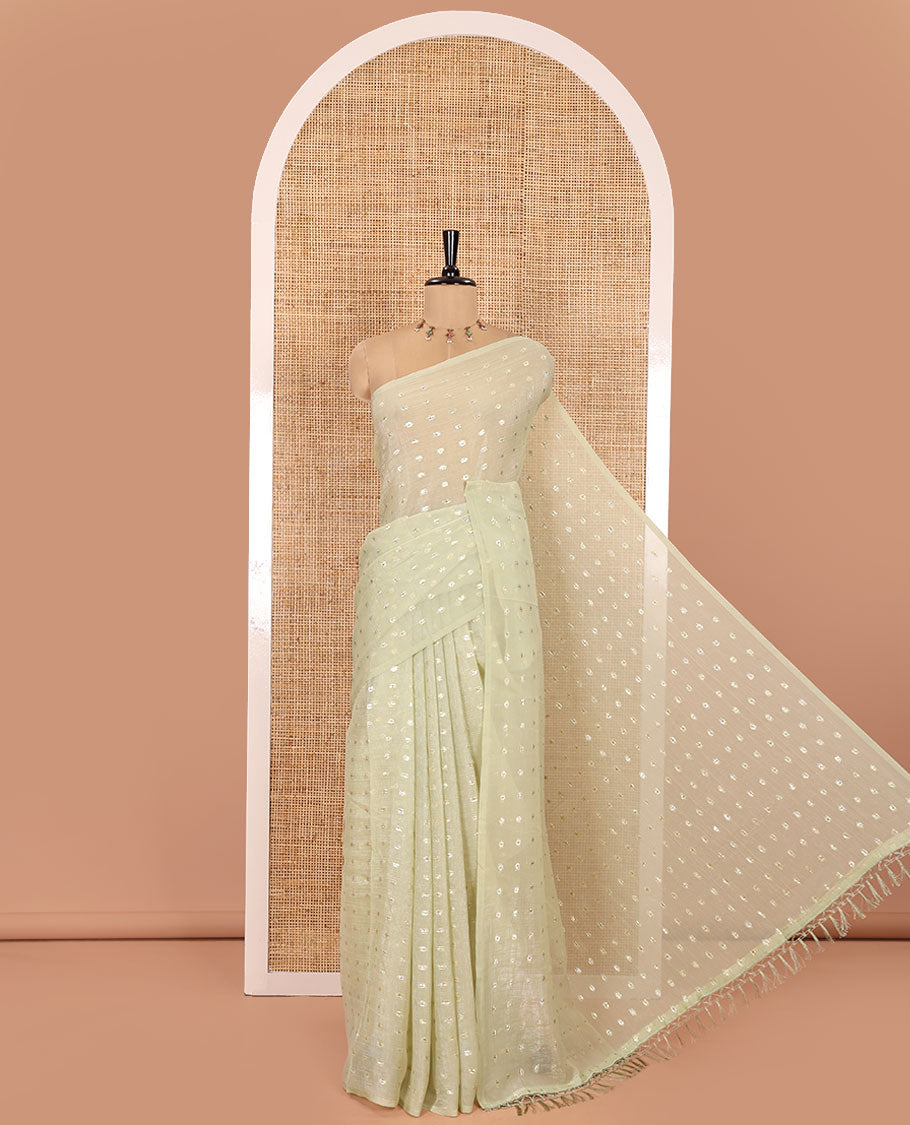 Borderless Pale Green Shimmer Saree, Detailed with Zari Buttas All Over Its Body, Pallu Mirrors the Same Buttas, and Comes Without a Blouse