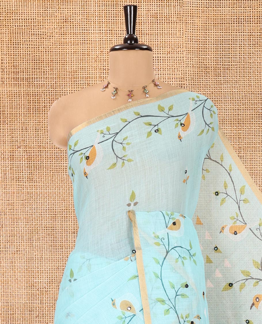 Sea Green Linen Cotton Saree, Adorned with Floral Vine Print and Mirror Work On Its Body, Subtle Piping Border, Pallu Steeped with Stripes, and Comes With a Contrast Blouse