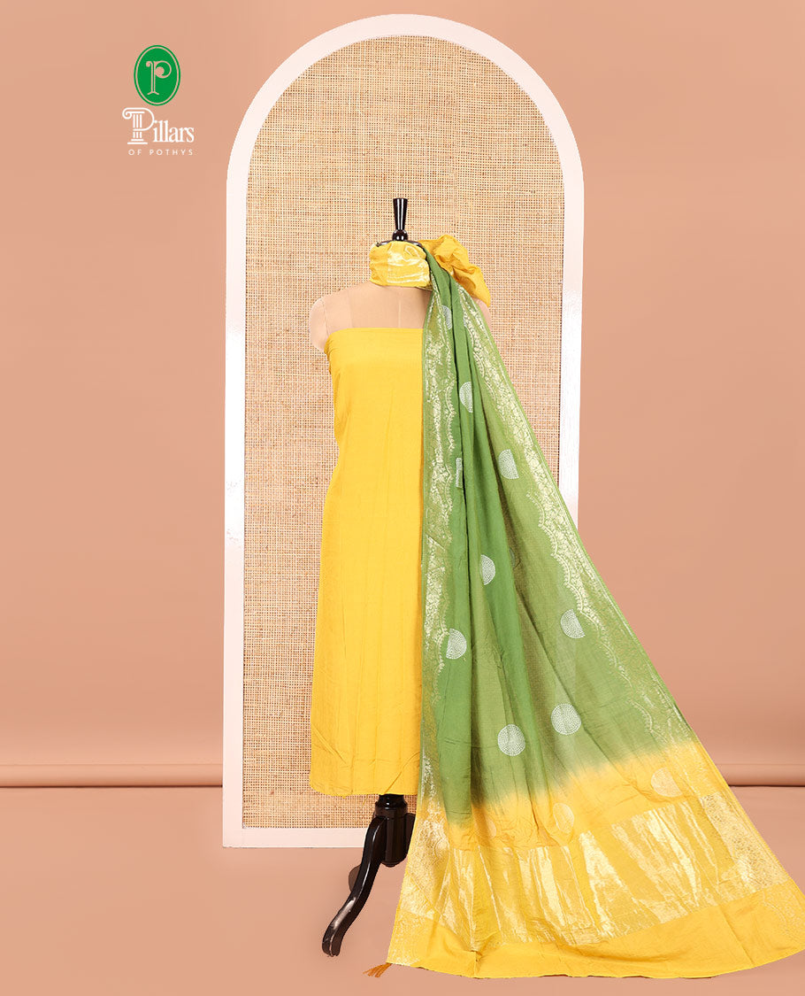 Yellow Semi Silk Material Churidar Set, Subtly Made Plain Top, a Plain Santoon Bottom, and Is Paired with a Dual-Colored Bandhani Motifs Semi Silk Dupatta