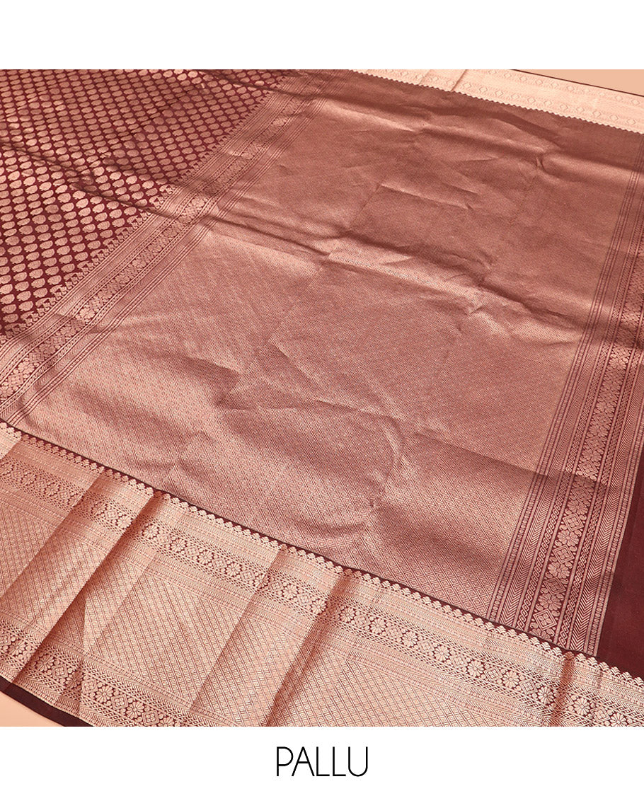 Brown Kanchipuram Silk Saree Enlivened with Zari Buttas, Complemented by Zari Border of Kathir, Neli, Kamalam, Chakram, Manga, and Mayil Kann Designs, Pallu Decked Up with Mayil Kann Designs, and Paired with a Matching Blouse