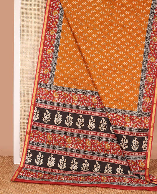 Orange floral motifs printed mul mul cotton saree, contrast floral vine printed border, and pallu of floral print