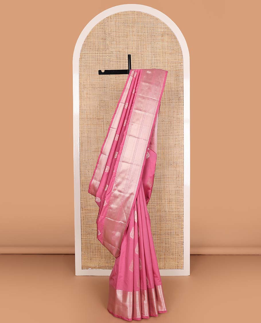 Pink zari buttas Vasundhara silk mix saree, zari border of thilakam mokku, muthu, ogee, and mayil kann, and neli striped pallu