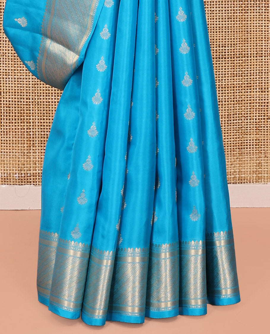 Blue Vasundhara Lite Silk Mix Saree, Adorned with Zari Buttas All Over Its Body, Highlighted by Zari Border of Thilakam Mokku, and Kodi Visiry Designs, Grand Jaal Pallu, and Paired with a Matching Blouse
