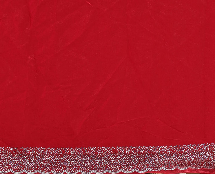 Maroon Swarovski crystal stone embedded fendy chiffon saree, scallop Swarovski stone embroidered border, and contrast plain blouse