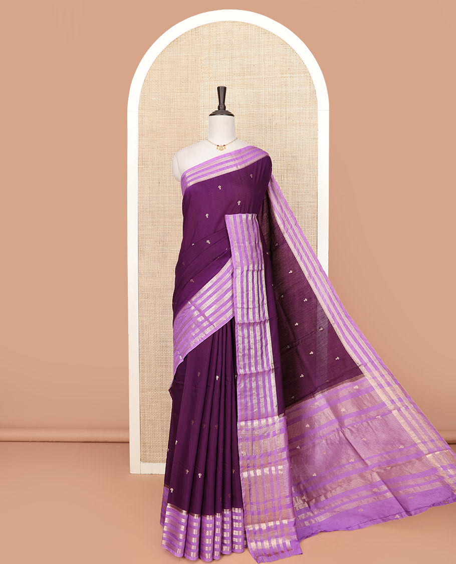Purple Assam Silk Saree Adorned with Zari Buttas, complemented by Contrast Zari Border Featuring Traditional Zari Designs, a Gleaming Pallu of Zari Stripes, and Paired with a Contrast Blouse