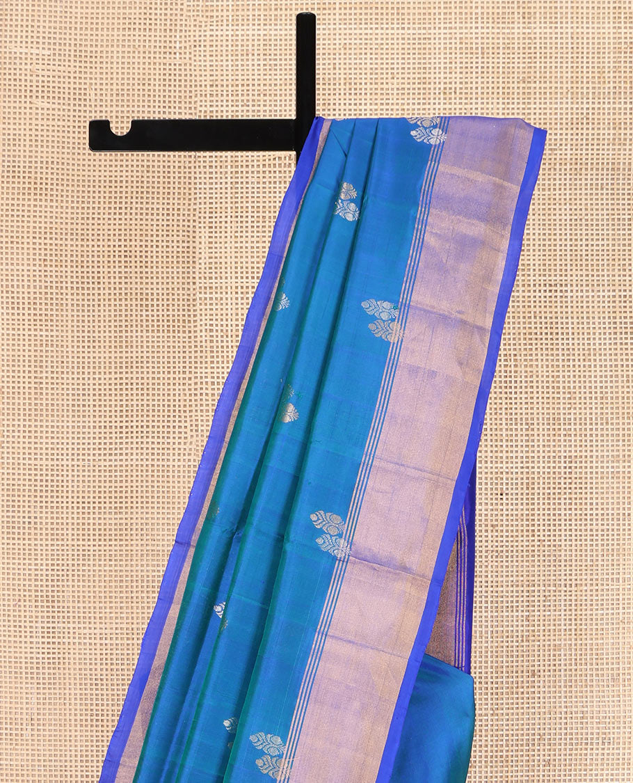 Blue Uppada Silk Saree, Embellished with Zari Buttas on Its Body, Complemented by Contrast Border, Pallu Steeped with Floral Zari Buttas, and Paired with a Contrast Blouse