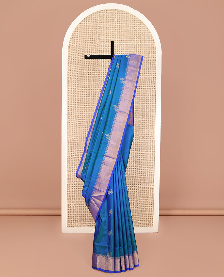 Blue Uppada Silk Saree, Embellished with Zari Buttas on Its Body, Complemented by Contrast Border, Pallu Steeped with Floral Zari Buttas, and Paired with a Contrast Blouse